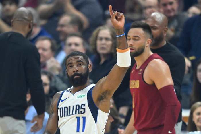 Feb 27, 2024; Cleveland, Ohio, USA; Dallas Mavericks guard Kyrie Irving (11) reacts to fans in the first quarter against the Cleveland Cavaliers at Rocket Mortgage FieldHouse.